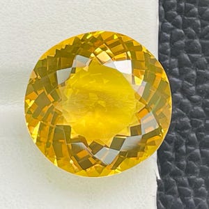 Facetterad citrin ädelsten, rundslipad, naturlig lös sten (19,70 ct) bild 1