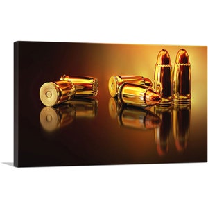 May include: A group of gold-colored bullet casings on a dark brown surface with a golden glow. The casings are arranged in a semi-circle with the tips facing the viewer.