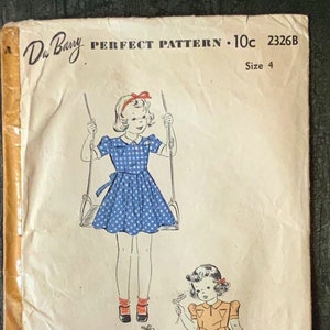 May include: Vintage sewing pattern for a girl's dress. The pattern is from the Du Barry Perfect Pattern line and is size 4. The pattern shows a girl in a blue polka dot dress on a swing and another girl in a yellow dress.
