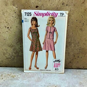 May include: Vintage Simplicity sewing pattern number 7125 for a dress and a skirt and top set. The pattern is for a size 12 with a bust measurement of 32 inches. The pattern is for a miss and is labeled "Jiffy" and "easy cut easy sew".