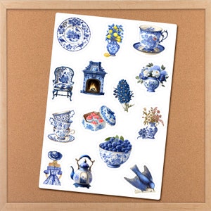 May include: A sheet of blue and white patterned stickers featuring various designs, including a teapot, a chair, a fireplace, a bowl of blueberries, a bird, a cup and saucer, and floral arrangements.