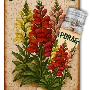 May include: Vintage style seed packet illustration of snapdragons with red, yellow, and pink flowers. The packet is a jigsaw puzzle piece with a small glass vial of seeds attached.