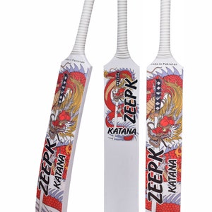 May include: Three white wooden cricket bats with a red and gold dragon design. The bats have the words "ZEERK" and "KATANA" printed on them. The bats are made in Pakistan.