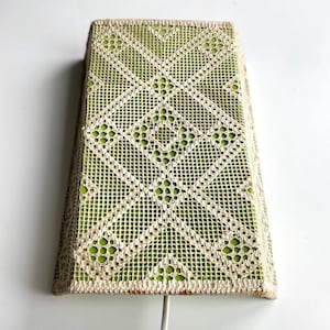 May include: A rectangular lamp shade featuring a cream-coloured crocheted lace overlay with a geometric diamond pattern. The lace is layered over a solid lime green fabric backing, creating a high-contrast visual effect across the entire surface.