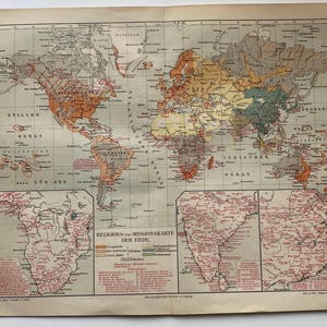 May include: A vintage paper world map titled Religions- und Missionskarte der Erde, featuring color-coded regions representing various religions. The map includes detailed insets of Africa and India, with text labels in German throughout the print.