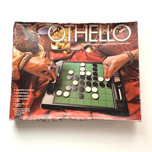 May include: Vintage Othello board game with a green playing surface and black and white game pieces. The box features the game title and text: "The ancient game of strategy from the mysterious East."