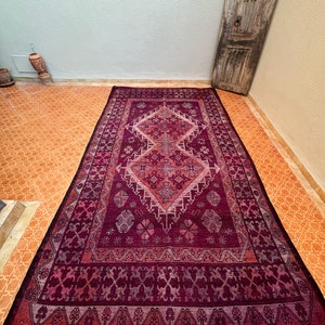 Turn the rug upside down at least once every three months, allowing foot traffic to assist in settling dust onto the floor, reminiscent of the traditional practice observed by Moroccan people.