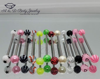 May include: A collection of 18 stainless steel barbell body jewelry with colorful acrylic balls. The balls feature various designs, including stars, stripes, hearts, and glitter.