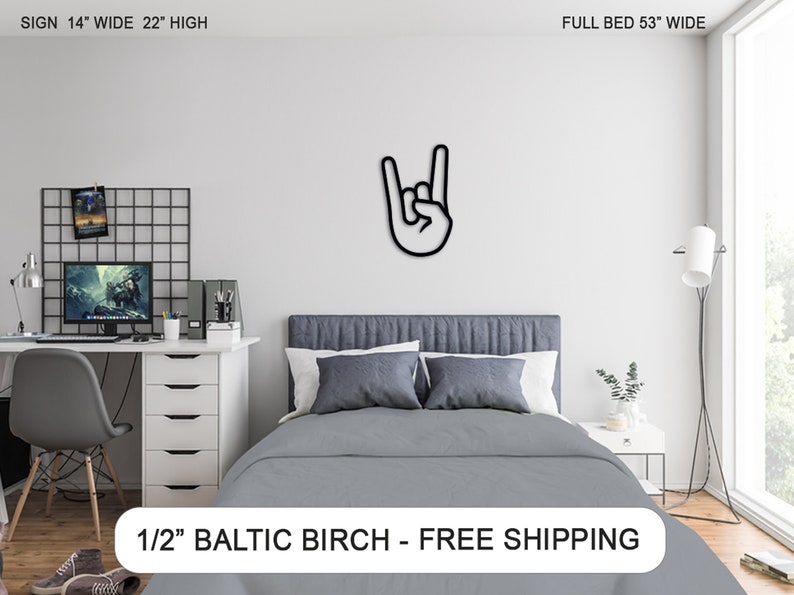 May include: Black and white rock and roll hand sign wall decor made from 1/2 inch Baltic birch wood. The sign is 14 inches wide and 22 inches high.