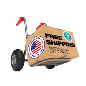 May include: A brown cardboard box with the words "FREE SHIPPING" printed on it. The box is on a hand truck with red handles and black wheels. The box also has a sticker that says "Proudly Made in USA" with an American flag design. The box also has a sticker with the text "C+D" and a blue and white logo.