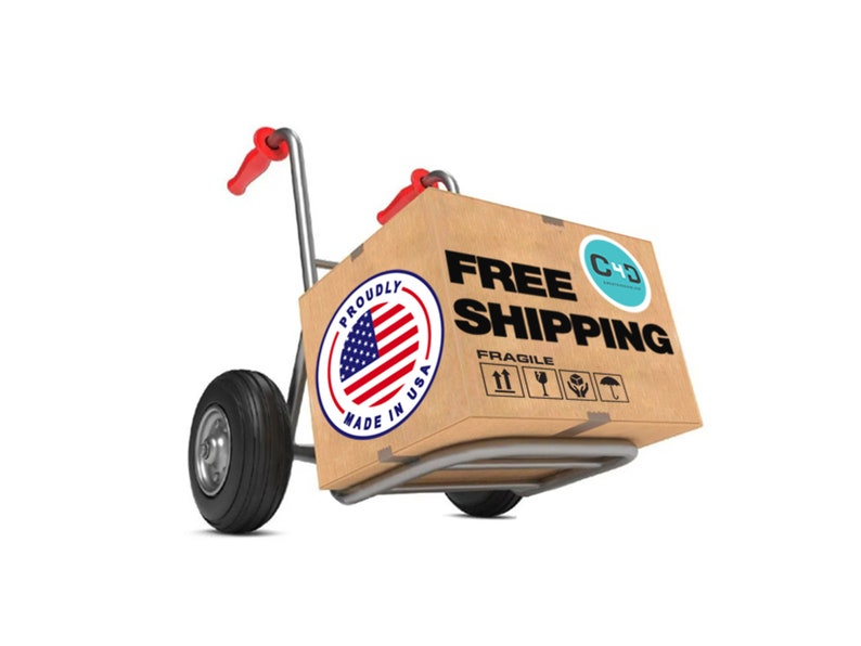 May include: A brown cardboard box with the words "FREE SHIPPING" printed on it. The box is on a hand truck with red handles and black wheels. The box also has a sticker that says "Proudly Made in USA" with an American flag design. The box also has a sticker with the text "C+D" and a blue and white logo.