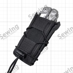 May include: A silver multi-tool with exposed metal hinges and screws is partially inserted into a black nylon sheath. The sheath features a woven fabric construction with a black elastic cord lacing system and a plastic cord lock at the base.