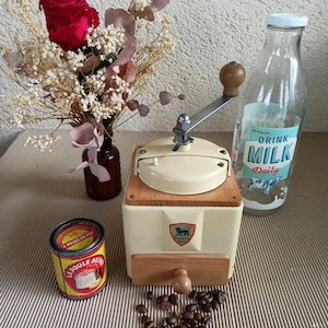 Superb old PEUGEOT coffee grinder in cream lacquered steel, original paint and logo in very good condition.