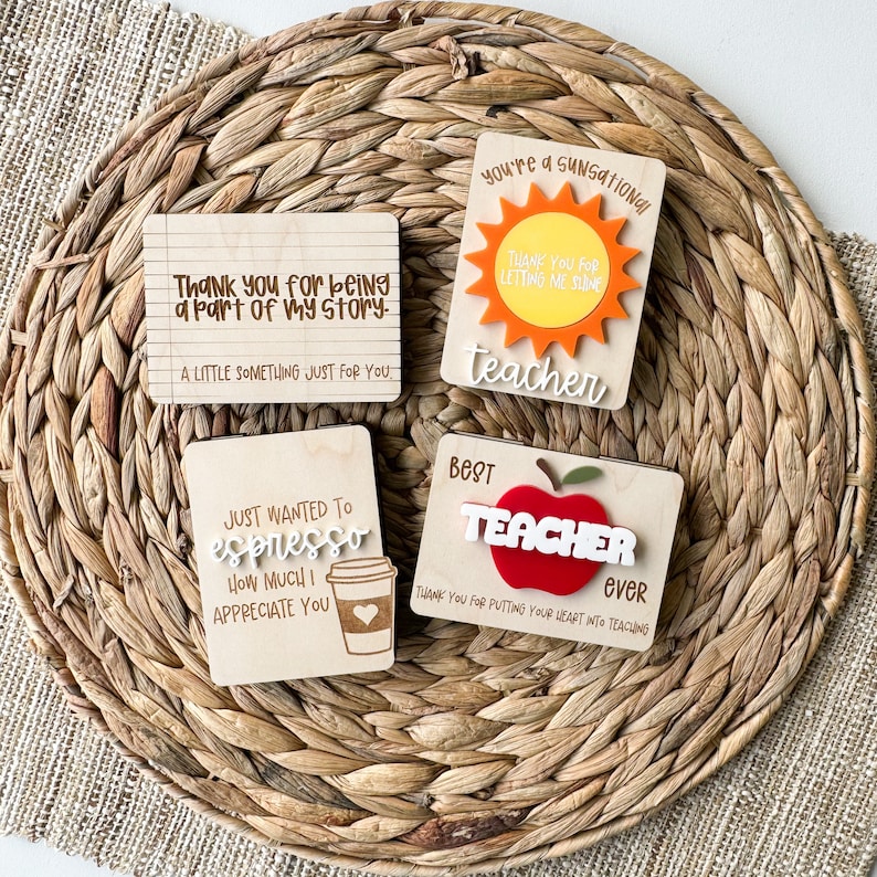 May include: Four wooden teacher appreciation plaques with different designs and sayings. The first plaque says "Thank you for being a part of my story. A little something just for you." The second plaque says "You're a SunSational Teacher. Thank you for letting me shine." The third plaque says "Just wanted to espresso how much I appreciate you." The fourth plaque says "Best Teacher ever. Thank you for putting your heart into teaching."