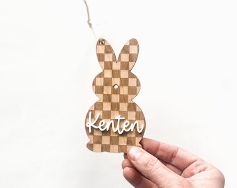 May include: Wooden Easter bunny ornament with a checkered pattern and the name "Kenten" written in white.