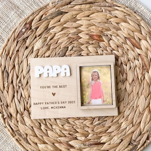May include: Wooden sign with the word "PAPA" in large letters, a small photo frame, and the text "You're the best", "Happy Father's Day 2025", and "Love, McKenna".