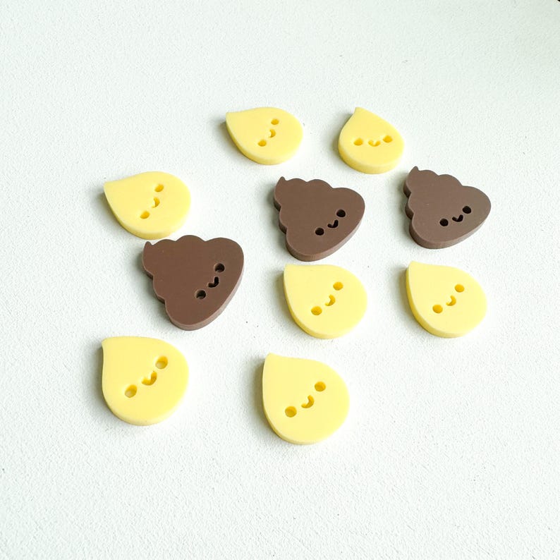 May include: A set of ten small, colorful, plastic figurines. The figurines are shaped like a drop of water and a pile of poop. Each figurine has a cute, cartoon face.
