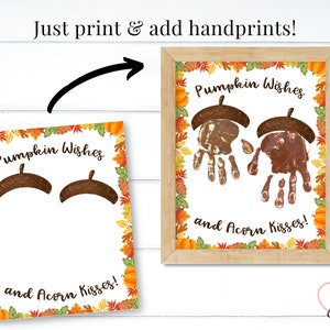May include: Printable craft activity with a fall theme. The image shows a blank template with the text "Pumpkin Wishes and Acorn Kisses!" and two acorn shapes for handprints.