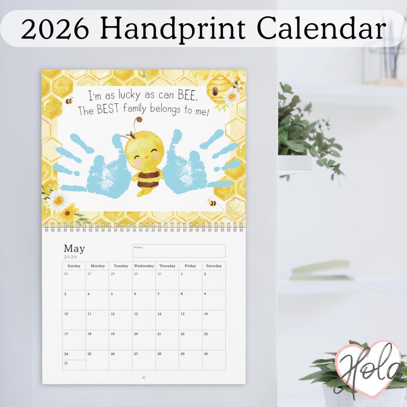 May include: A 2026 handprint calendar with a bee theme. The calendar features a yellow and brown cartoon bee, blue handprints, and the text "I'm as lucky as can BEE. The BEST family belongs to me!" The month of May is displayed.