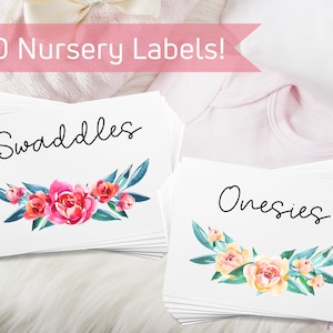 May include: A set of 80 blank nursery labels with floral designs. The labels are divided into two stacks, one labeled "Swaddles" with pink flowers and the other labeled "Onesies" with yellow flowers.