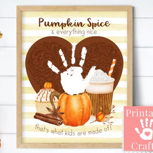 May include: Printable craft for kids featuring a handprint in the shape of a heart with fall-themed elements like a pumpkin, cupcake, and a cup of pumpkin spice latte. The text reads "Pumpkin Spice & everything nice that's what kids are made of!"