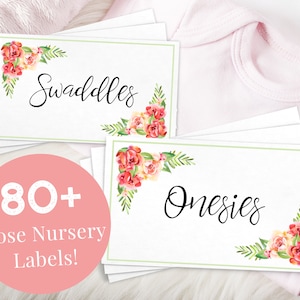 May include: Set of 80+ printable baby shower gift tags with a floral design. The tags are white with a green border and feature the words "Swaddles" and "Onesies" in black cursive font.