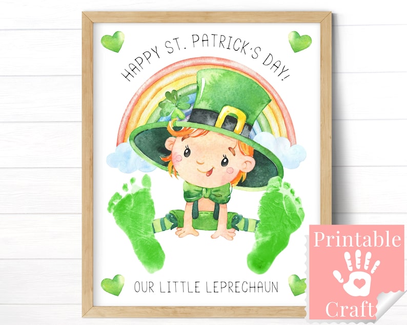 Framed 8x10 printable footprint craft that reads Happy Saint Patricks Day Our Little Leprechaun. A baby's footprints are stamped to look like the feet of a baby leprechaun.