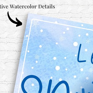 May include: A blue watercolor background with white snowflakes and dots. The text "Let it snow" is written in black cursive.