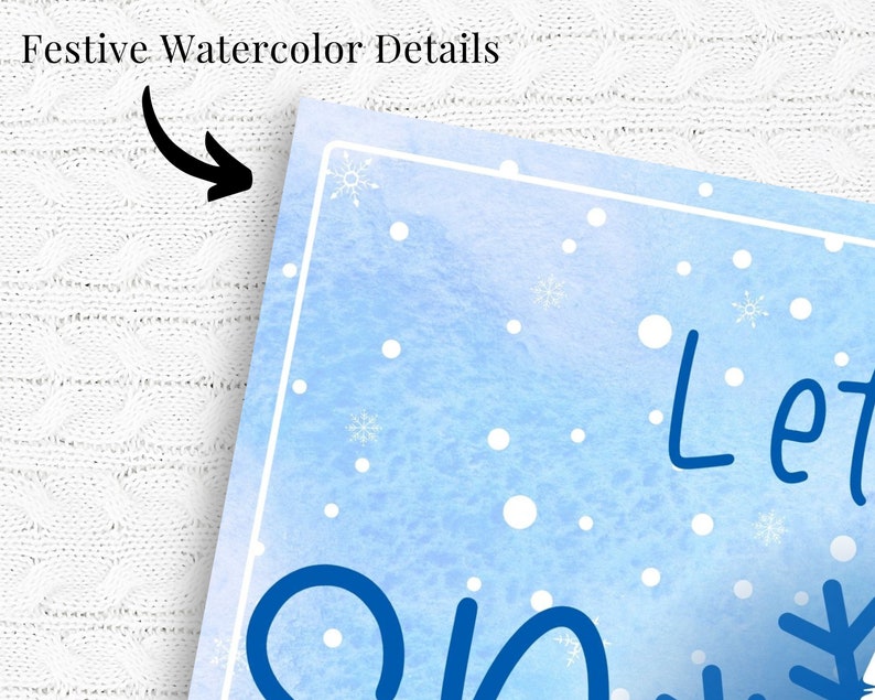 May include: A blue watercolor background with white snowflakes and dots. The text "Let it snow" is written in black cursive.