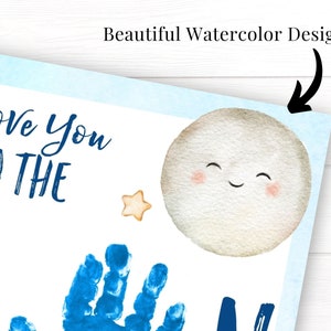 May include: A white card with blue text that reads "I love you to the" and a blue handprint. A watercolor moon with a smiling face and a yellow star are also on the card.