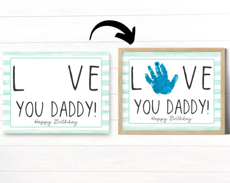 May include: Two printable cards with a blue and white striped background. The text on the cards reads "LOVE YOU DADDY! Happy Birthday". One card has a blank space for a handprint, and the other card has a blue handprint in the space.