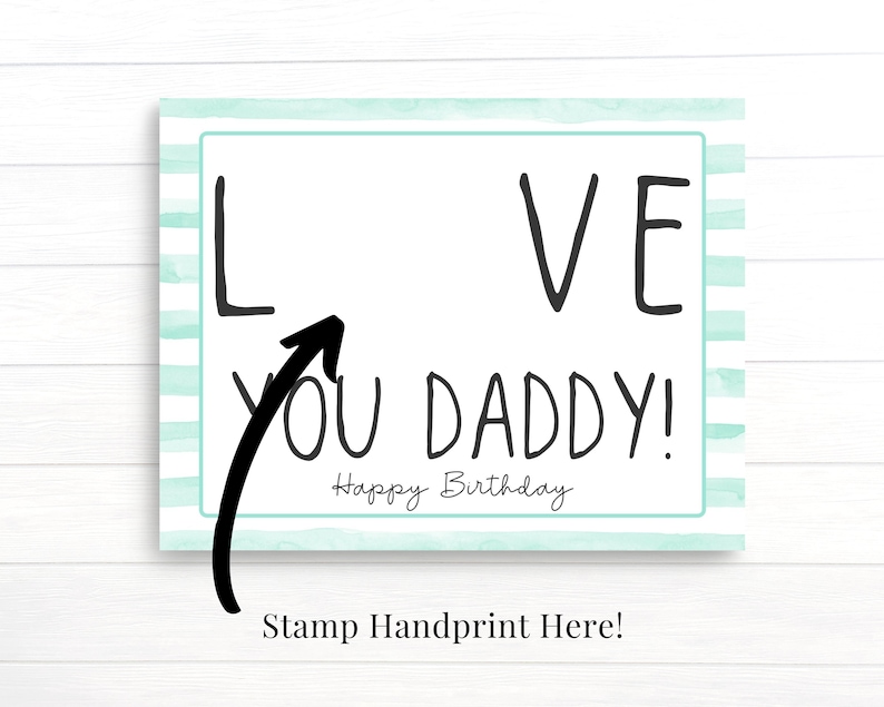 May include: A light blue and white striped card with the words "I LOVE YOU DADDY!" and "Happy Birthday" written in black. An arrow points to the "I" in "I LOVE YOU DADDY!" with the words "Stamp Handprint Here!" below the card.