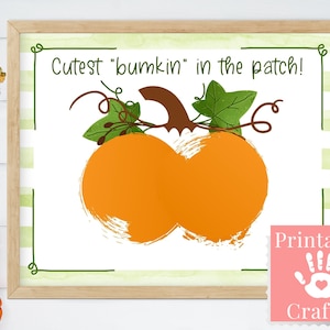 May include: Printable craft with a handprint and the text "Cutest "bumkin" in the patch!"  A cartoon orange pumpkin with green leaves is in the center of the image.