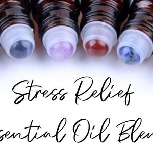 May include: A set of ten brown glass roller bottles with colourful gemstone tops. The bottles are labelled "Stress Relief Essential Oil Blend".