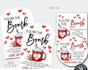 May include: Printable Valentine's Day gift tags featuring a red mug with hot chocolate and the text "You're the Bomb". The tags are 2.75 inches by 4 inches and are available as a DIY editable template.