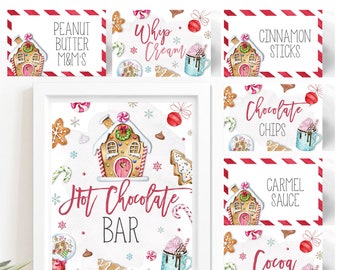 May include: Printable food labels for a hot chocolate bar with a gingerbread house theme. The labels feature illustrations of gingerbread houses, candy canes, and snowflakes. The labels include text such as "Hot Chocolate Bar", "Peanut Butter M&M's", "Whip Cream", "Cinnamon Sticks", "Chocolate Chips", "Carmel Sauce", and "Cocoa".