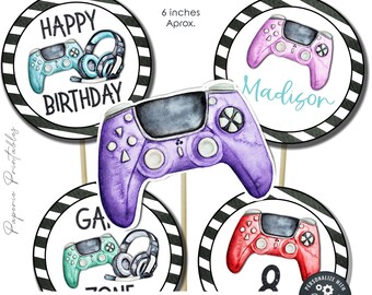 May include: Set of six printable 6-inch round cupcake toppers featuring a black and white striped background with a colorful video game controller and the text "Happy Birthday", "Game Zone", "Madison", and a number 8.