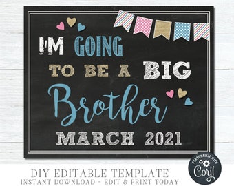 May include: A black chalkboard sign with white chalk writing announcing "I'm going to be a big brother March 2021". The sign is decorated with pink, blue, and gold bunting and hearts.