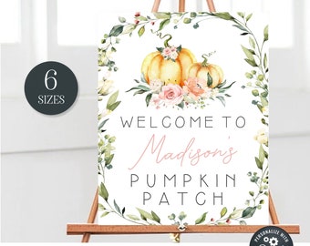 May include: A printable sign with a watercolor wreath of greenery and flowers, two pumpkins, and the text "Welcome to Madison's Pumpkin Patch".