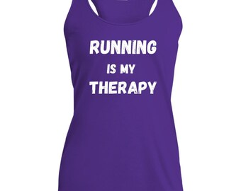 May include: A purple racerback tank top with the text "RUNNING IS MY THERAPY" in white block letters. The tank top has a scoop neck and is made of a lightweight material, suitable for running and other athletic activities.