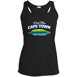 May include: Black racerback tank top with a graphic of Table Mountain in Cape Town, South Africa. The design includes the text "Dee Ma CAPE TOWN MAY 24, 2026" in a blue and white font, with a colorful illustration of the mountain.