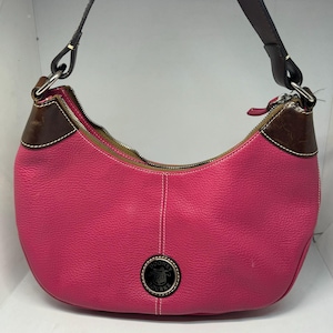 Vintage Dooney and Boourke Magenta Pink pebble leather bag with dark brown shoulder strap, inside zippered pocket, key ring holder