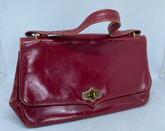 Vintage Quality Red leather small handback with Rulis stamped inside, attached change purse, zippered pocket, high end read leather