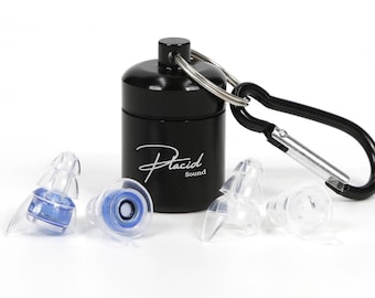 May include: A black cylindrical container with the text "Placid Sound" in white script, a black carabiner, and several clear and blue earplugs. The earplugs are designed to fit in the ear canal.