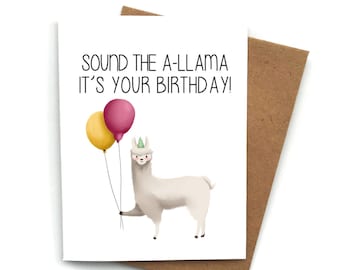 Puede incluir: Una tarjeta blanca con el texto "Sound the A-llama it's your birthday!" y una llama de dibujos animados sosteniendo dos globos, uno amarillo y otro rosa.