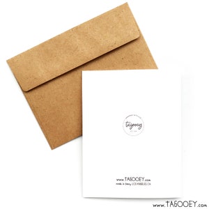 May include: A blank white card with a brown envelope. The card has a small black circle with the text "tagooney" inside. The text "www.tagooney.com" and "made in sunny Los Angeles, CA" are printed below the circle.