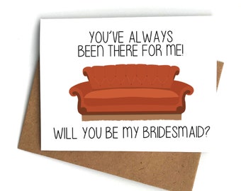 May include: A white card with the text "You've always been there for me!" and a cartoon image of an orange sofa. The text "Will you be my bridesmaid?" is below the sofa.