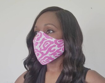 Pink breast cancer awareness face mask with nose wire in leopard print. Triple layer breathable, washable mask and soft adjustable ear loops