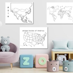 May include: Three black and white outline maps on a white background. The maps are of Asia, the United States of America, and the world. The maps are hanging on a white wall in a child's room. There are also some toys in the room, including a teddy bear, a pink armchair, and some colorful blocks.