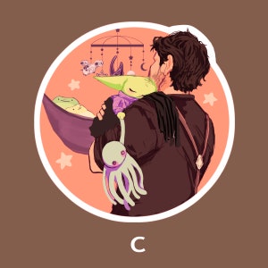 May include: A man with dark hair holds a small, green and purple creature in a purple sling. The creature is wearing a purple and white outfit. The man is wearing a brown jacket and a black shirt. The background is a light orange with stars and a mobile.